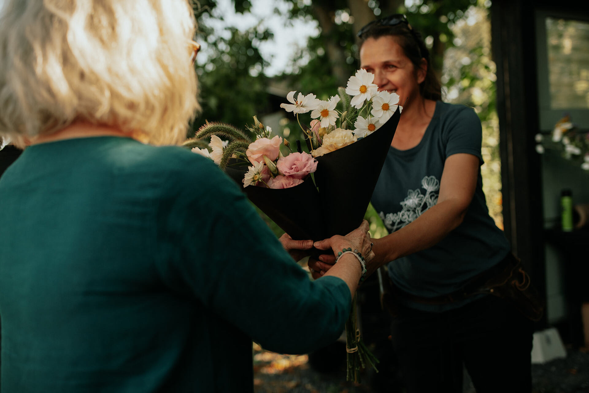 women with flower bouquet